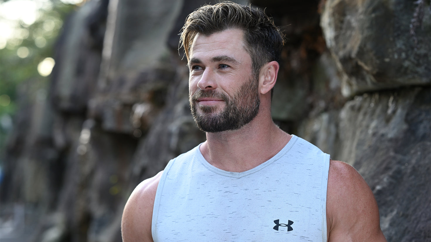 A close up shot of Chris Hemsworth looking away from the camera.