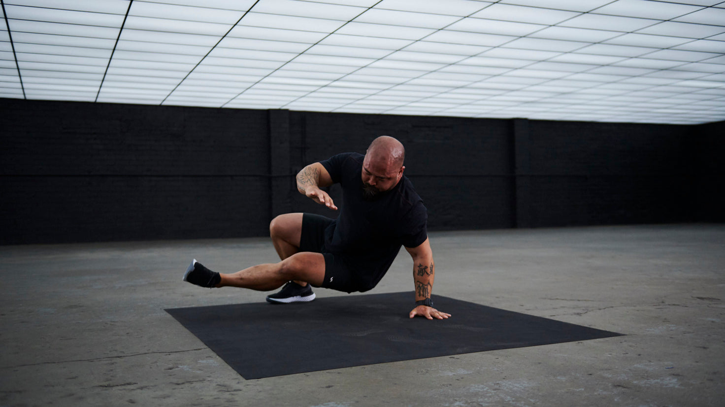 Centr trainer Da Rulk performs a sit-thru exercise.