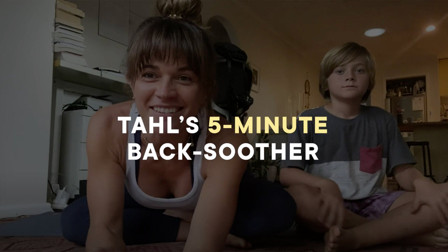 Still from a video that shows Centr Dynamic Yoga trainer Tahl Rinsky and her son about to practice y