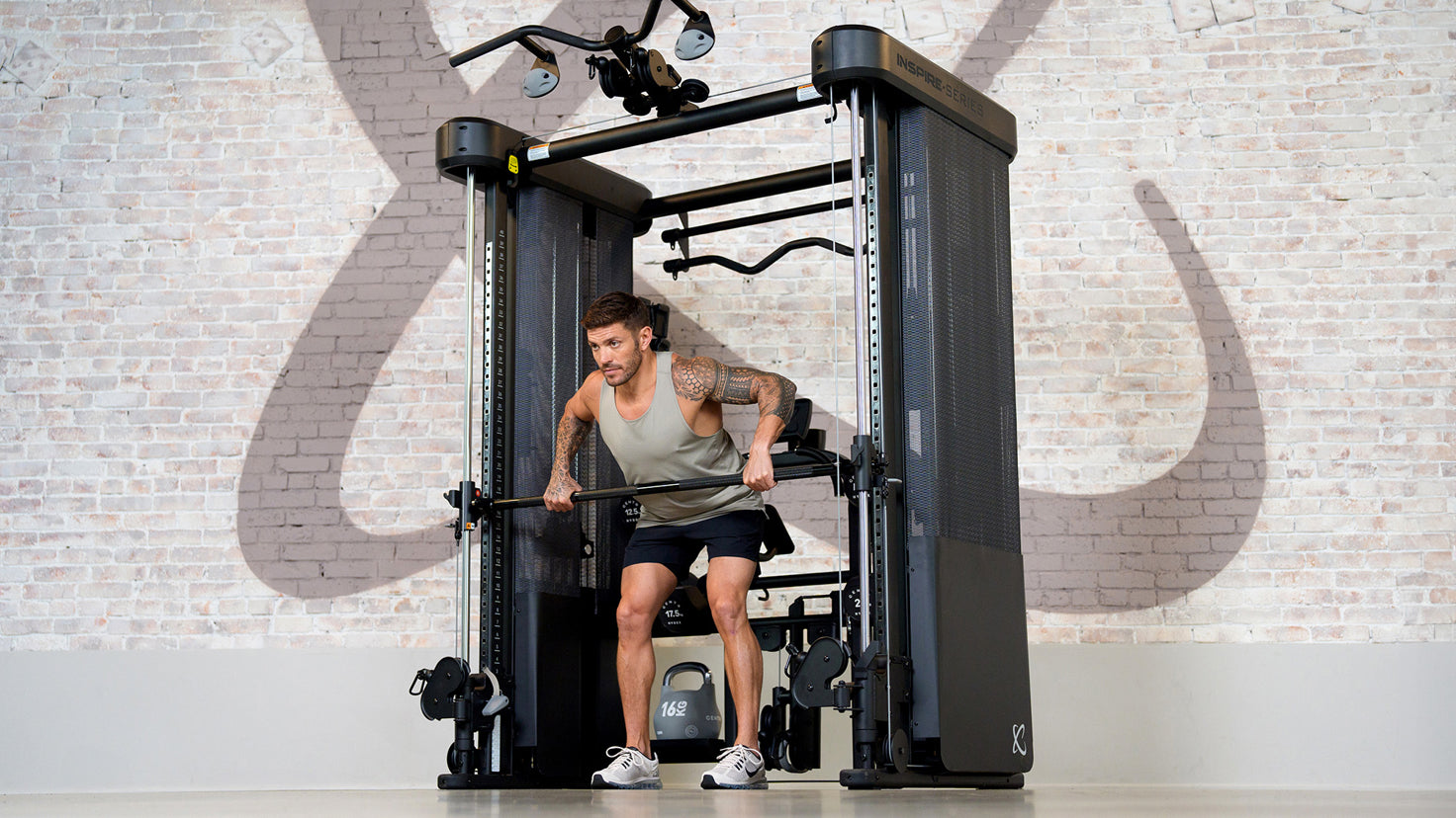 Centr trainer Luke Zocchi performs a deadlift using the Centr Muscle Pro machine.