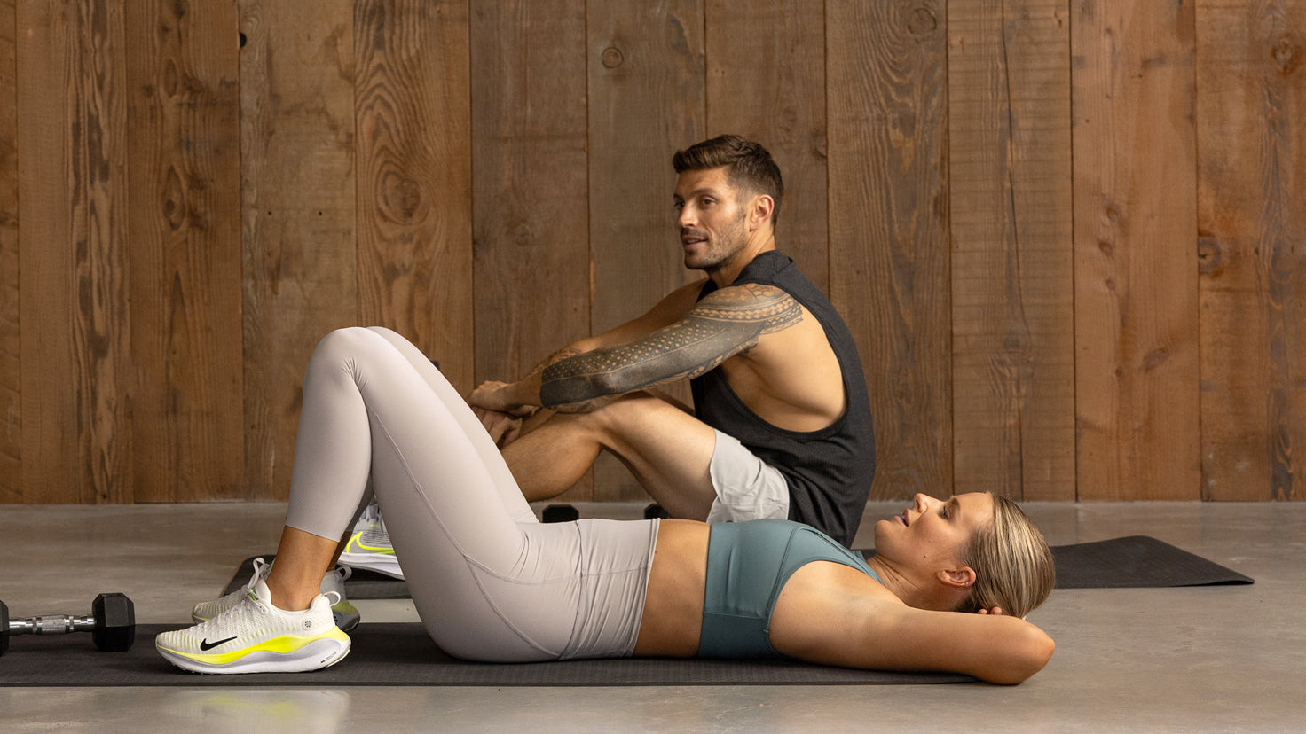 An image of Luke Zocchi & Alexz Parvi relaxing on a studio floor.