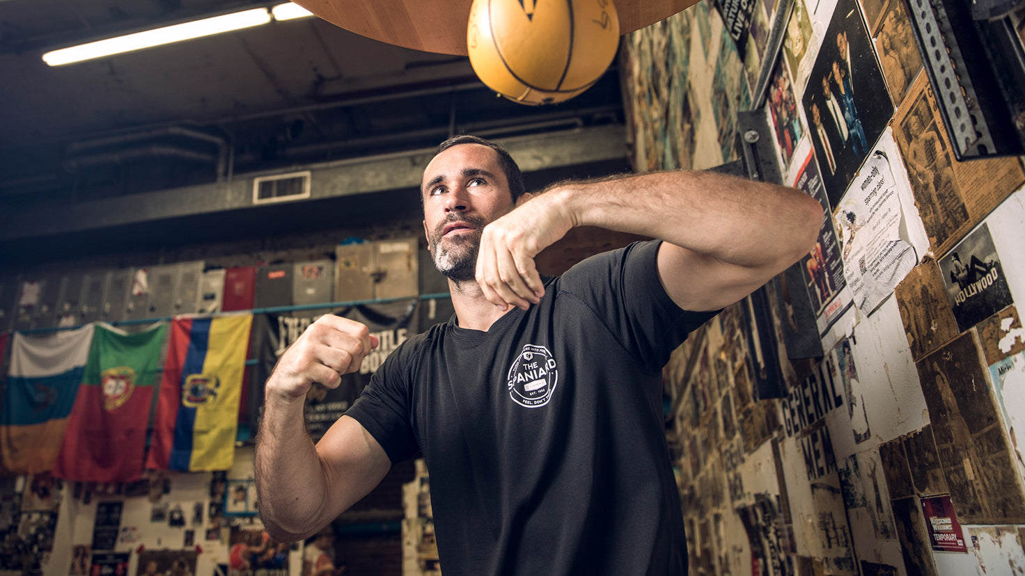 Jorge Blanco punches a boxing speed ball in a boxing gym.