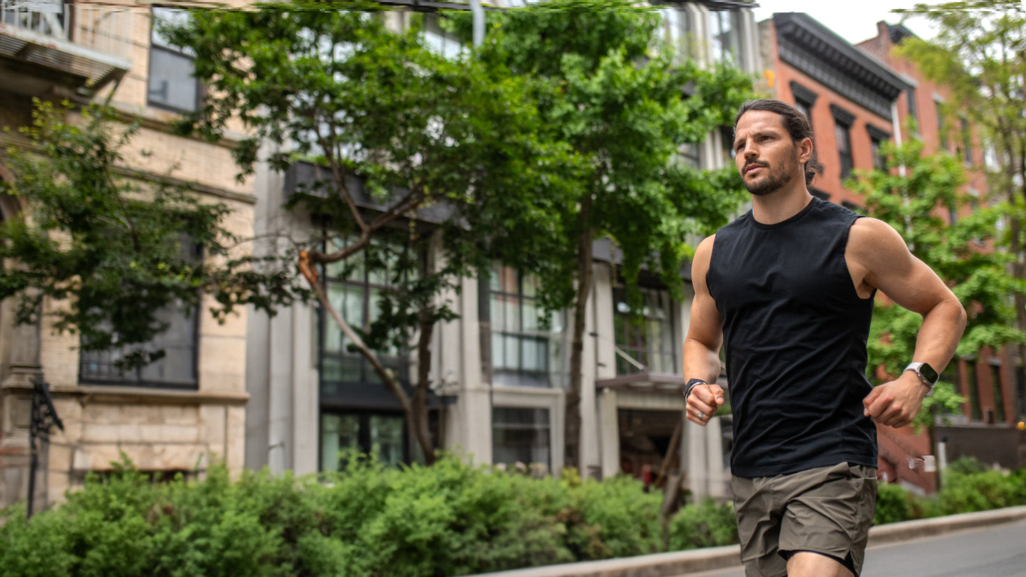Centr trainer Dan Churchill runs along a tree-lined street in the city.