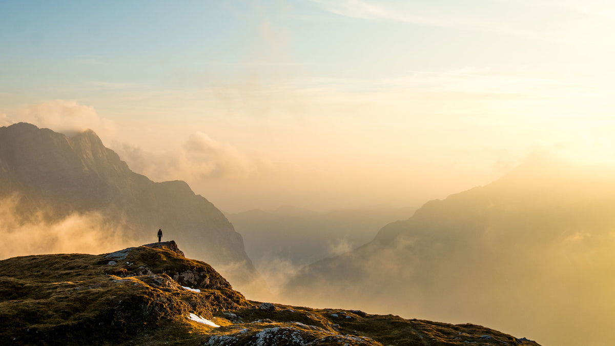 A person standing on a mountain.